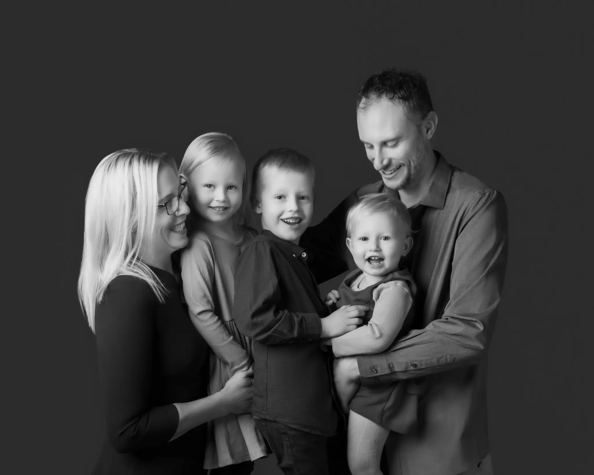 A black-and-white BP Portraits family portrait